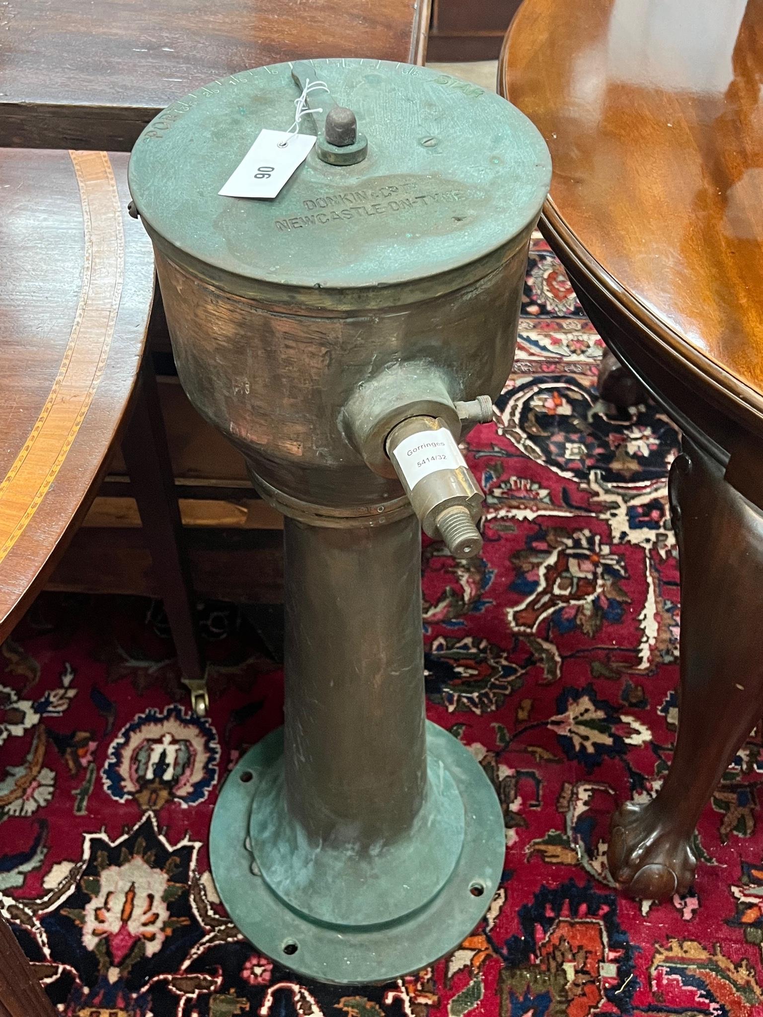 A Donkin and Co ships steering column, height 86cm.